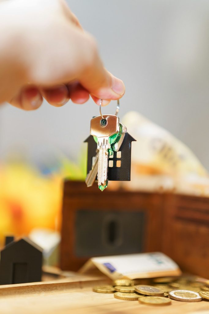 heres-a-caption-for-the-image-new-house-keys-with-money-and-a-wallet-aw5qbikgmzc hand holding new house door keys wallet money price real estate market